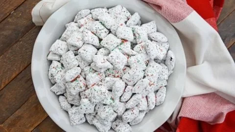 Festive Christmas Puppy Chow recipe with holiday decorations