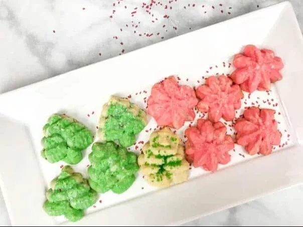 Decorative Christmas Spritz Cookies placed on a festive holiday table.