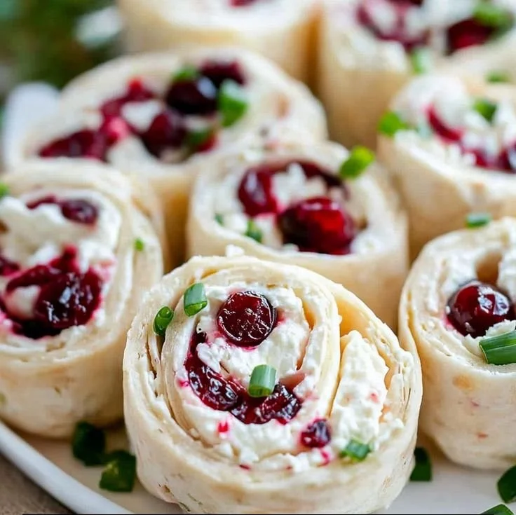 Festive Christmas Cranberry Roll Ups on a festive table setting
