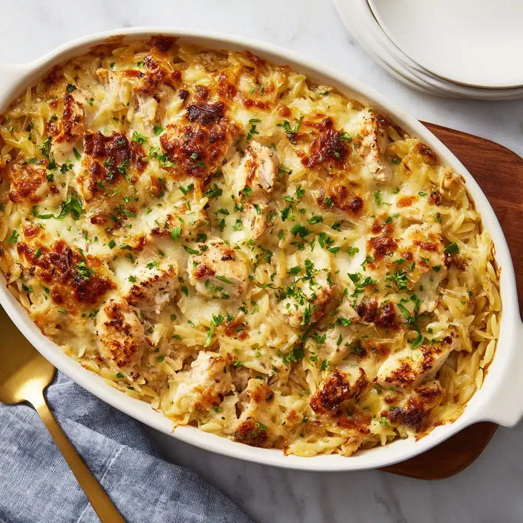 French Onion Chicken Orzo Casserole with melted cheese and herbs